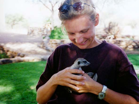 Anja Naude - petting a baby meerkat